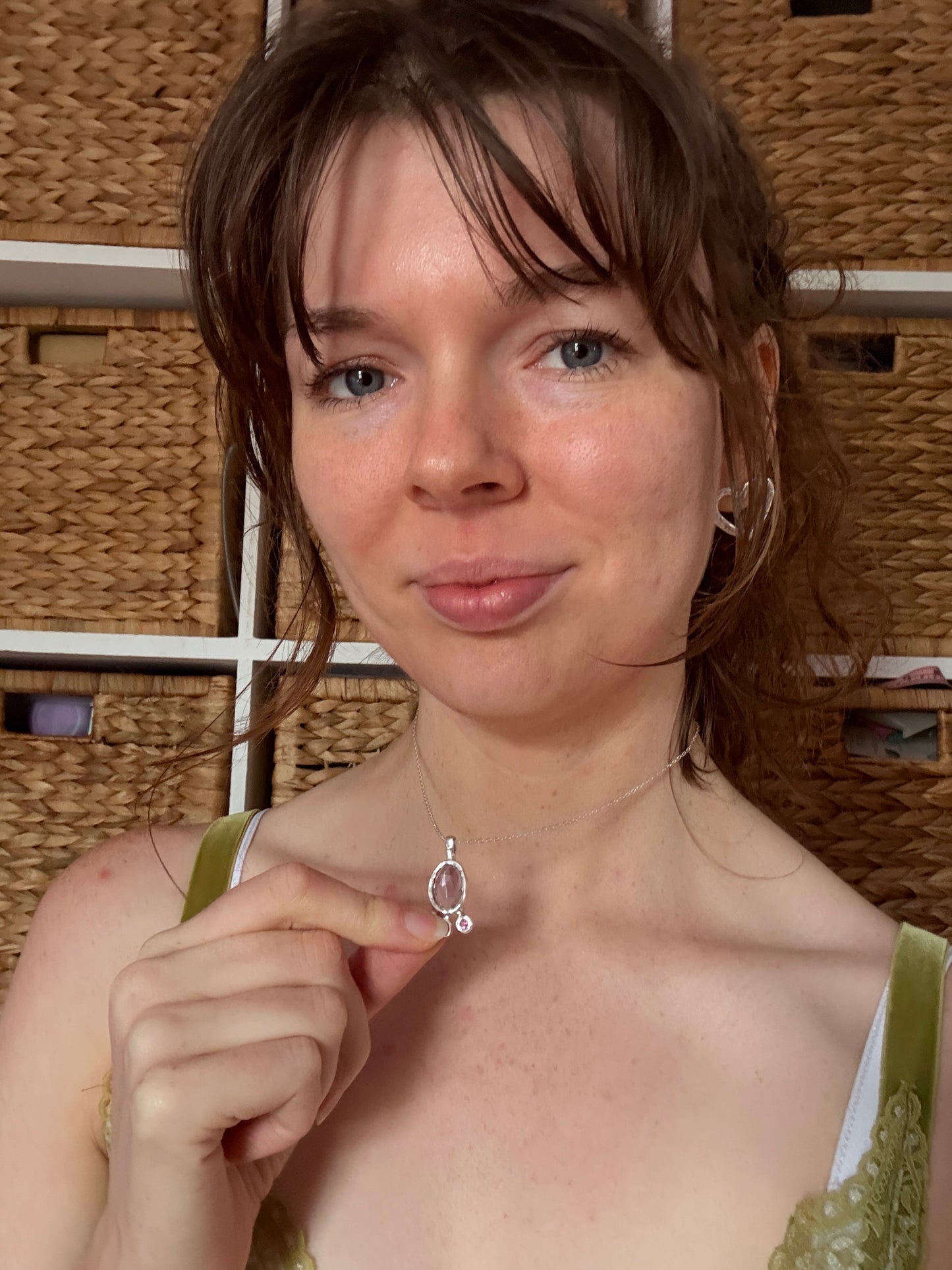 Woman wearing silver bohemian necklace with lilac amethyst and pink topaz gemstones