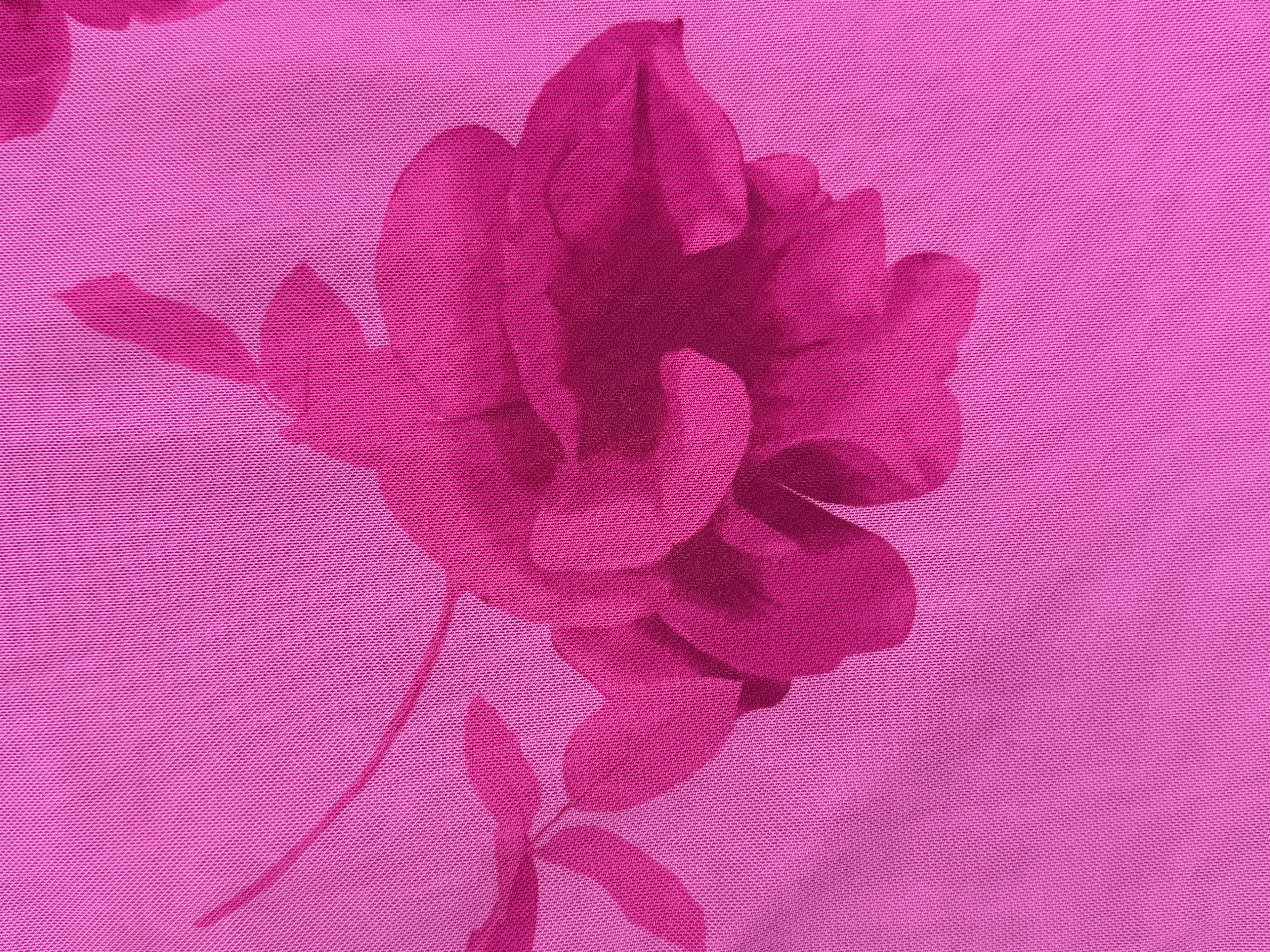 Floral design on a pink fabric background
