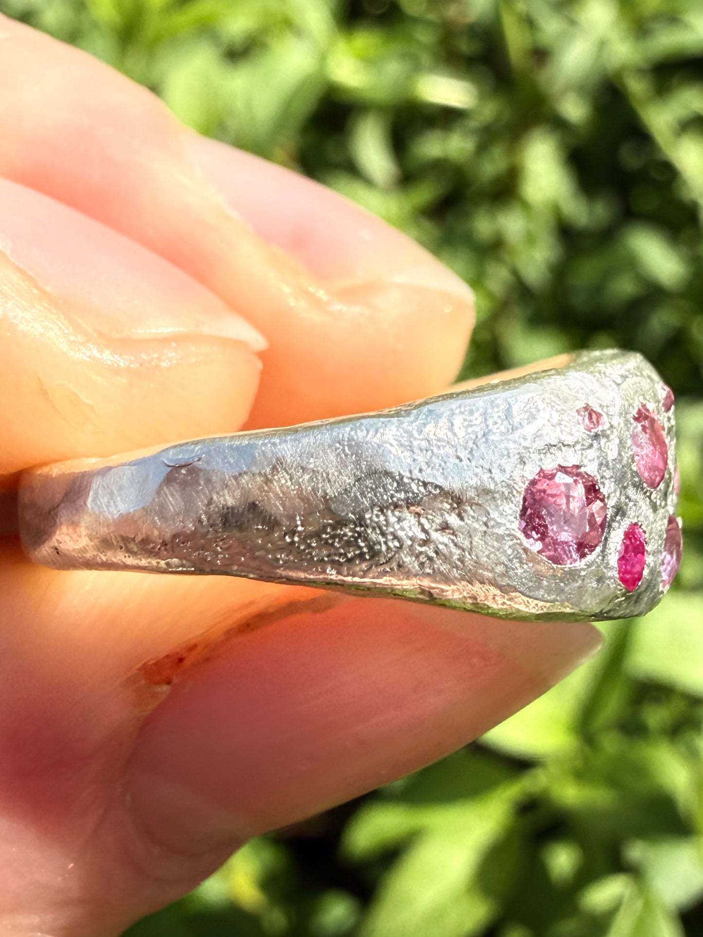 Pink tourmaline, rubelite and ruby handmade silver ring close up of sand cast texture 5