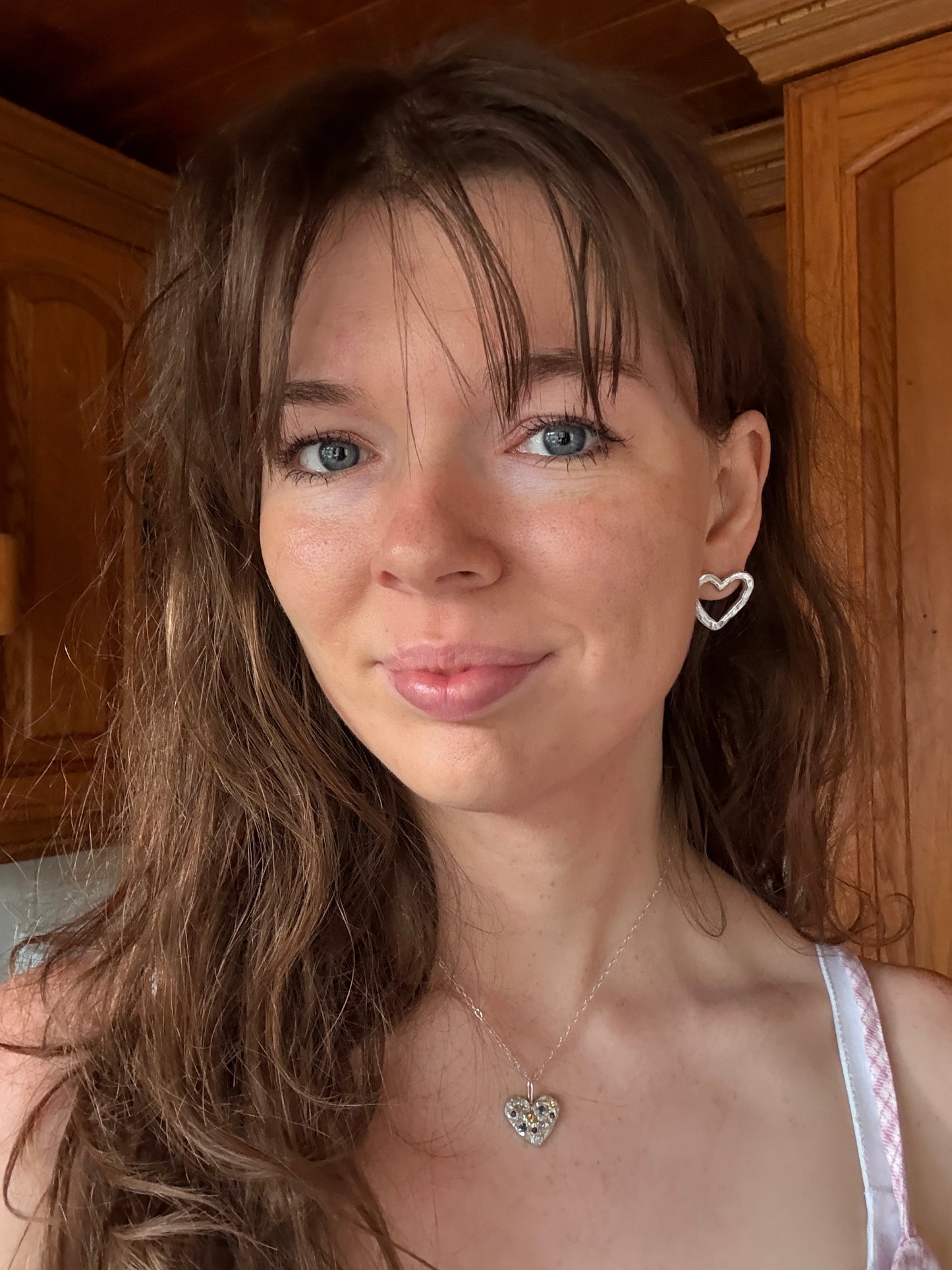 Silver Heart Stud Earrings on Woman