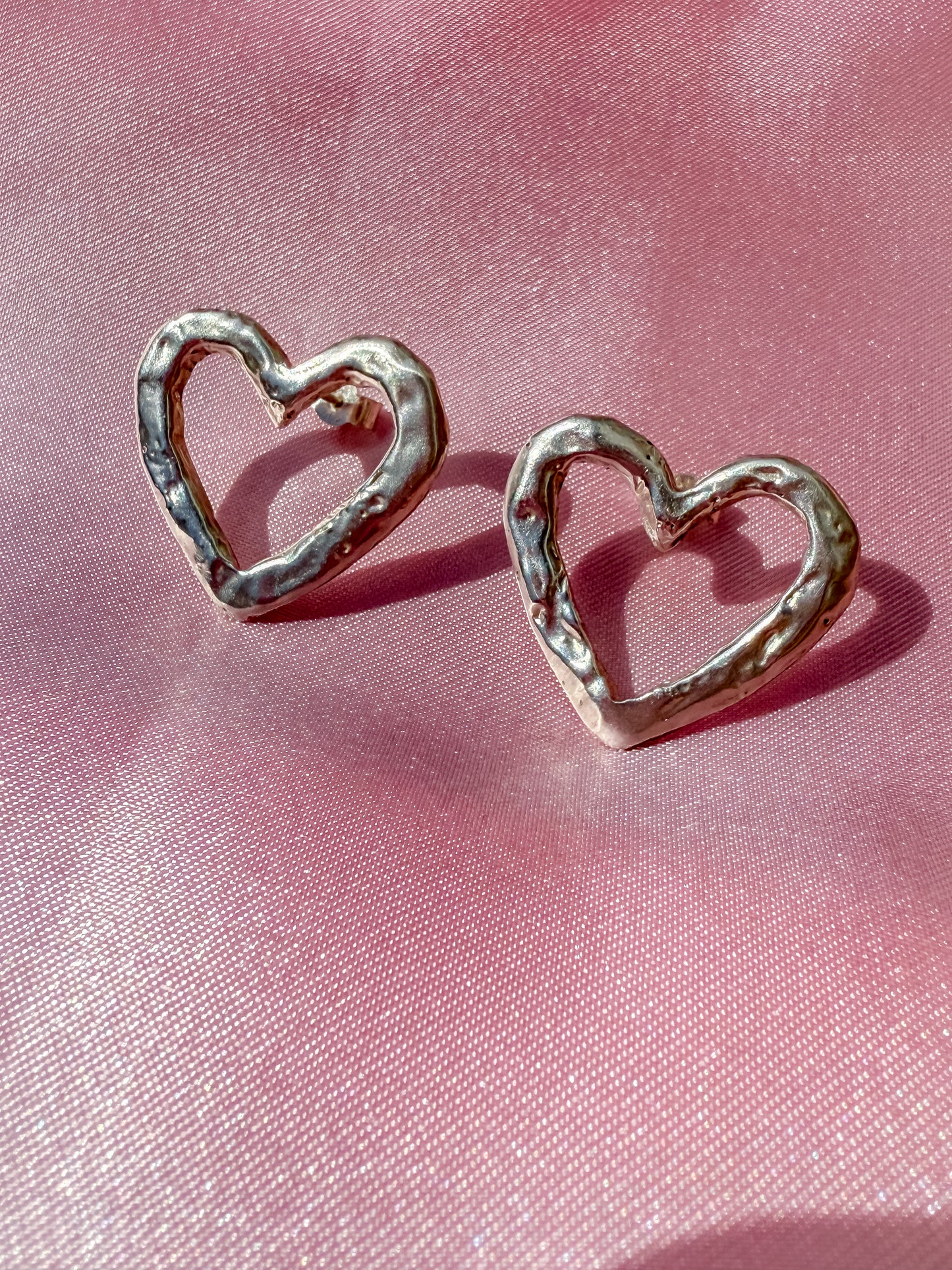 Silver Heart Studs with rippled molten metal texture