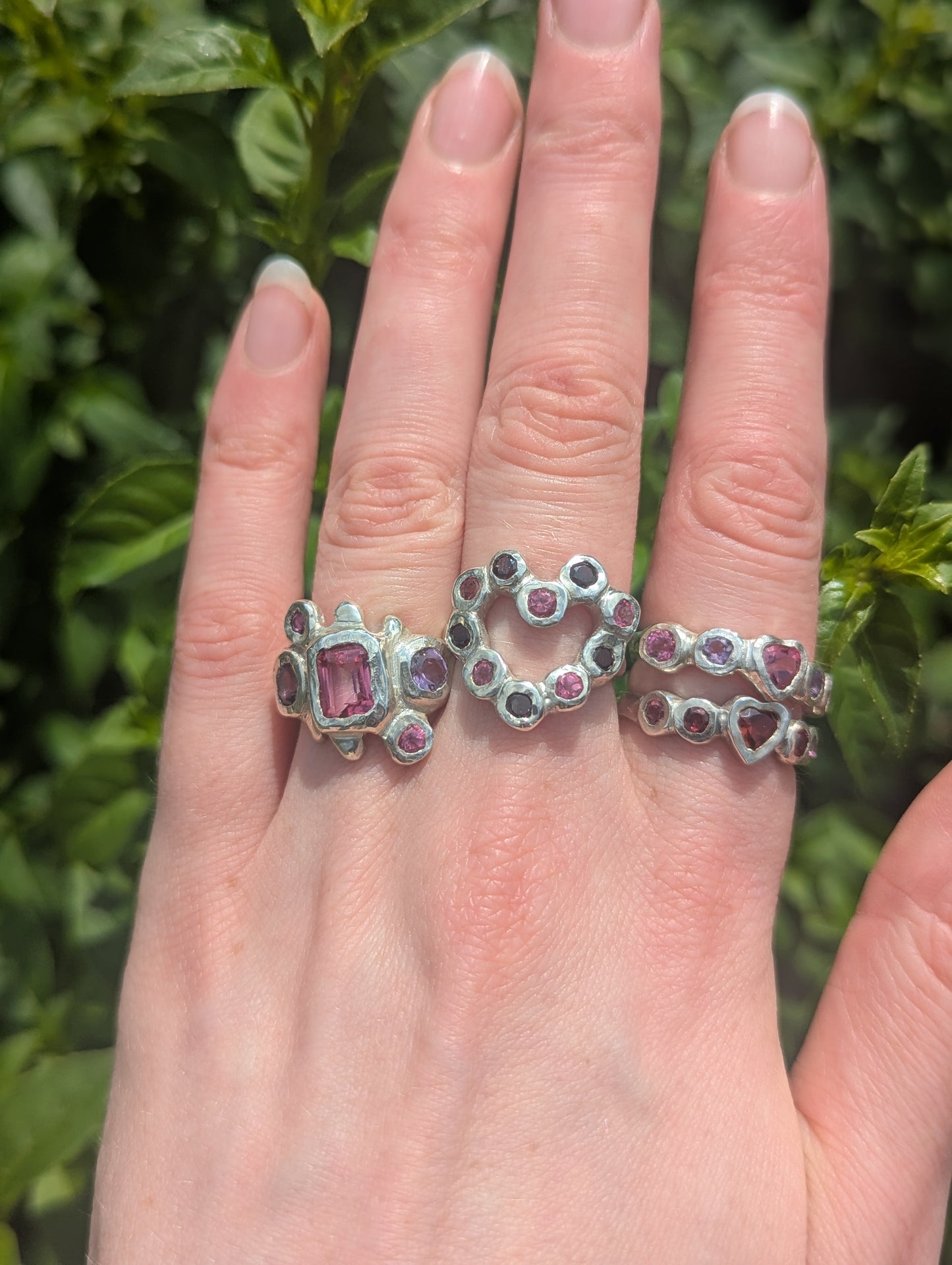 Silver girly rings with heart, pink, purple and red gemstones