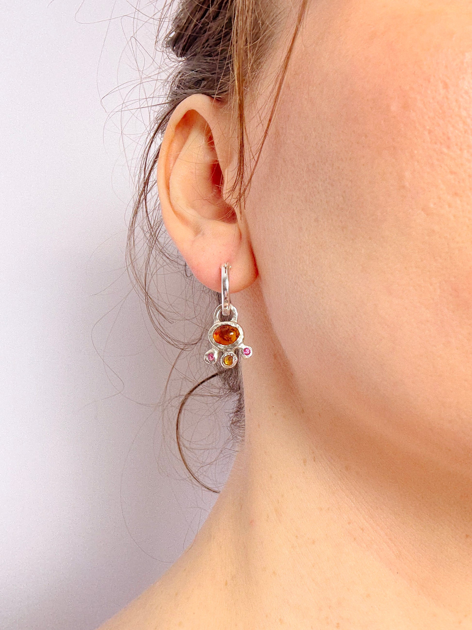 Amber and pink topaz hoop earring silver charm in ear