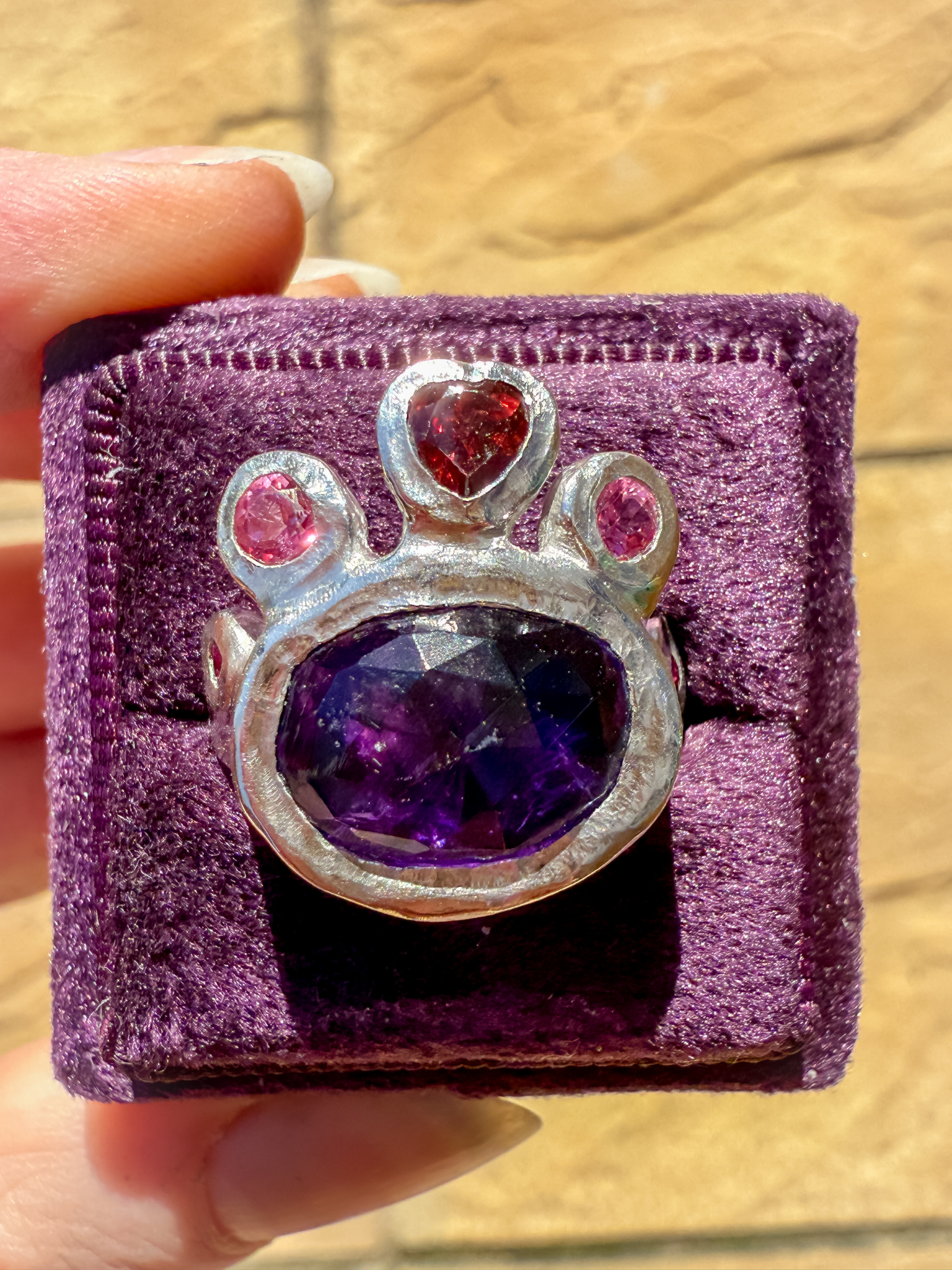 Silver ring with purple amethyst and red garnet heart gemstones