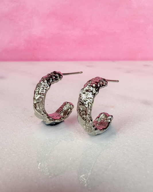 Chunky and Textured Handmade Silver Hoop Earrings on white background