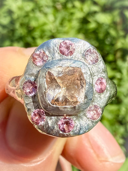 Close up of cushion cut peach morganite and pink tourmaline handmade silver ring 