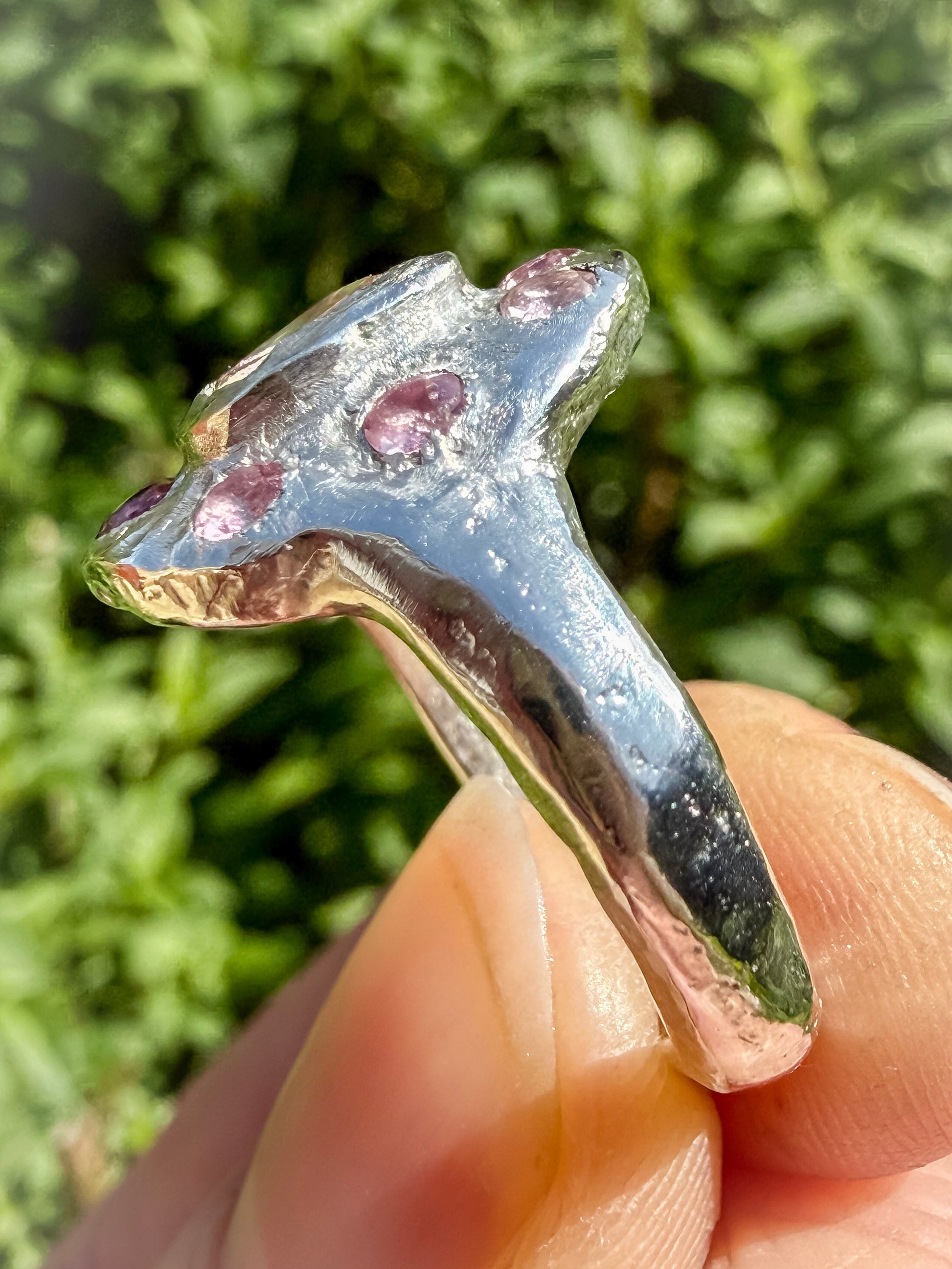 Close up of Cushion cut peach morganite pink tourmaline handmade silver ring showing sand cast ring shank