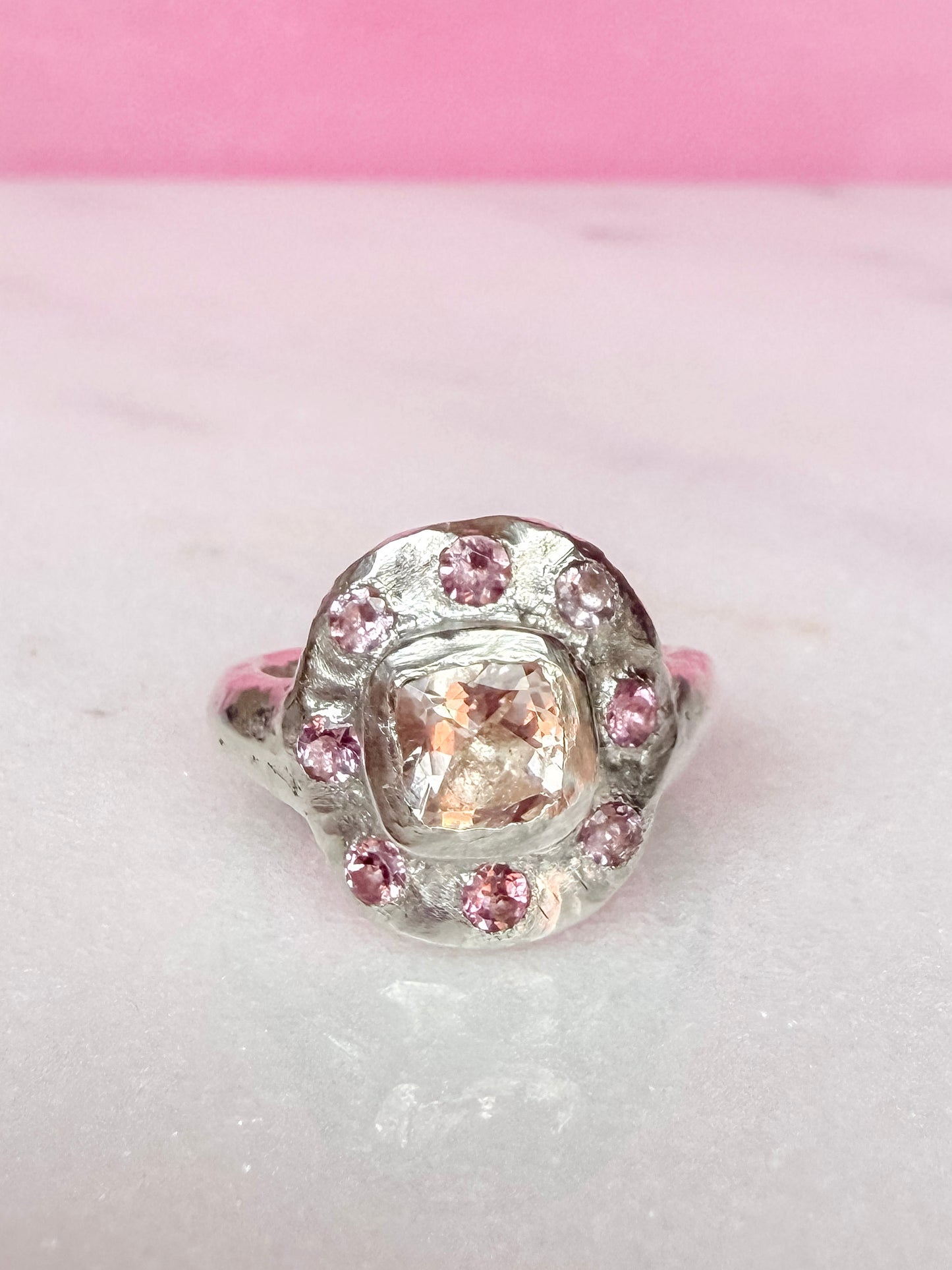 Cushion cut peach morganite pink tourmaline handmade silver ring on white and pink background