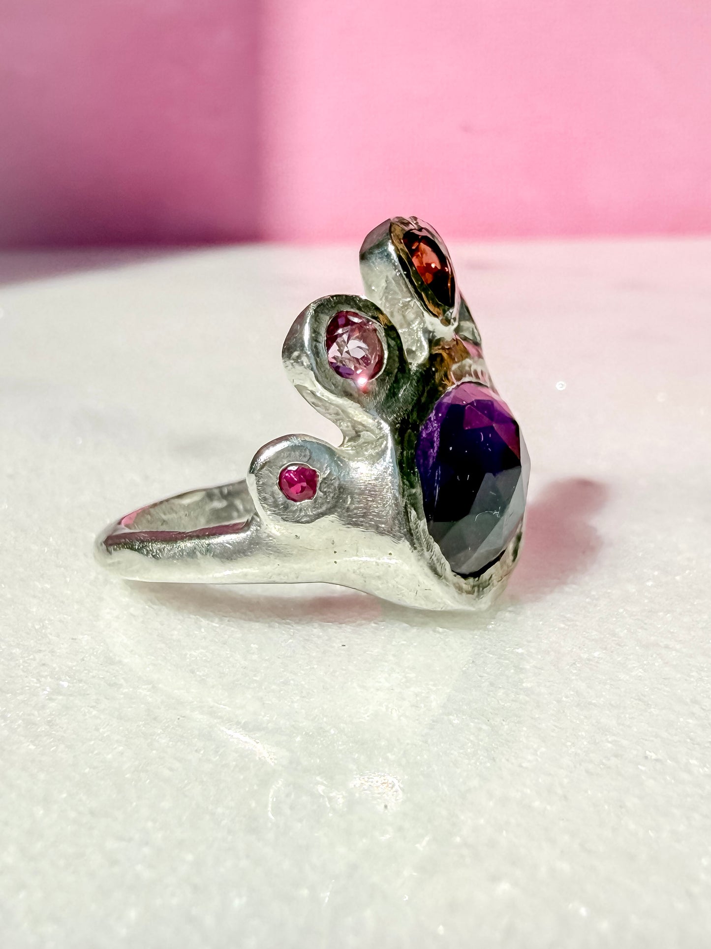 Dark amethyst slice, garnet heart, pink topaz and ruby handmade silver ring side view 1
