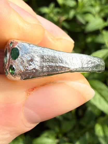 Green sapphire, emerald, tsavorite garnet and moissanite handmade silver ring close up of sand cast texture 6