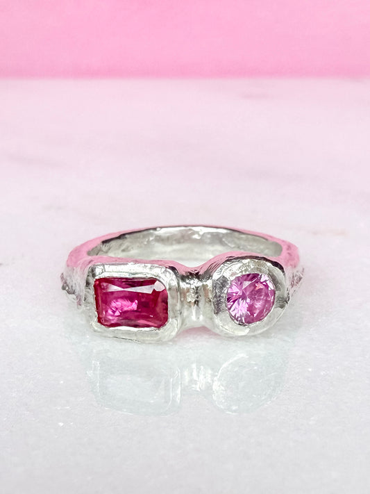 Lab grown octagon ruby and lab grown round pink sapphire handmade silver ring on white background