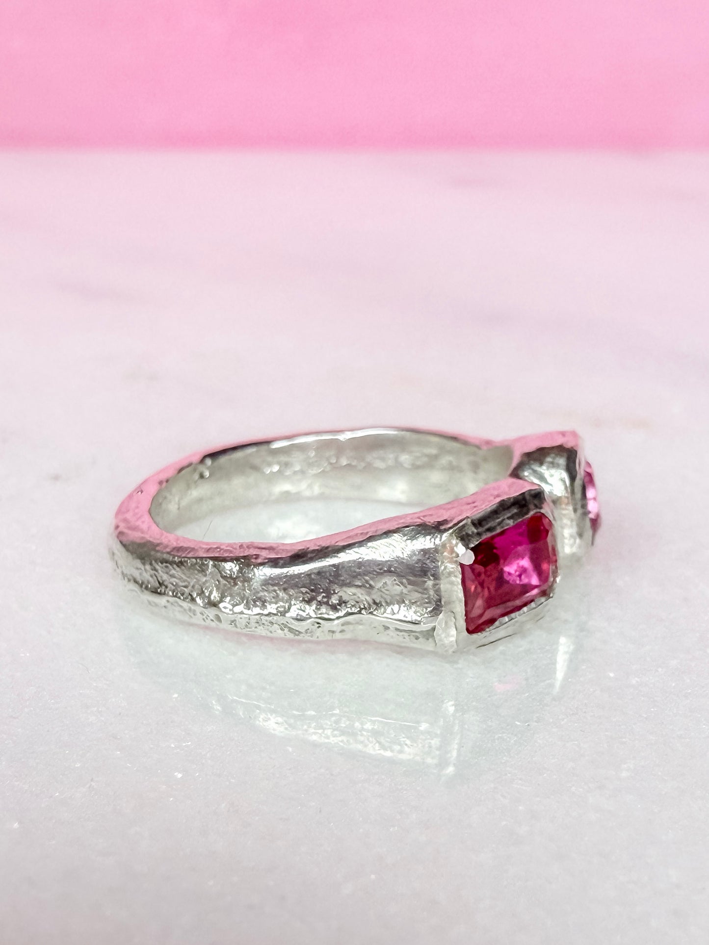 Lab grown octagon ruby and lab grown round pink sapphire handmade silver ring side view 1