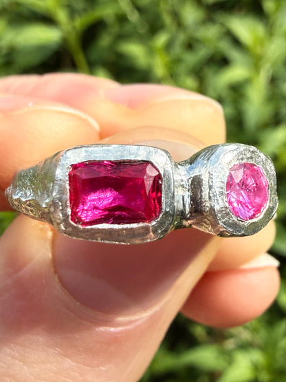 Lab grown octagon ruby and lab grown round pink sapphire handmade silver ring close up of sand cast texture 1
