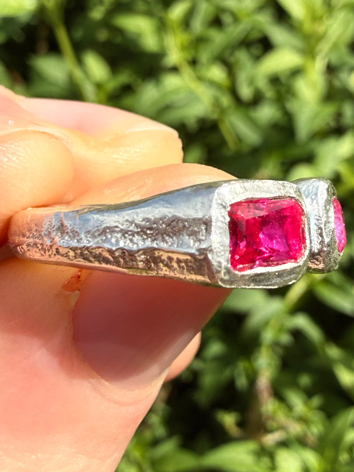 Lab grown octagon ruby and lab grown round pink sapphire handmade silver ring close up of texture 2
