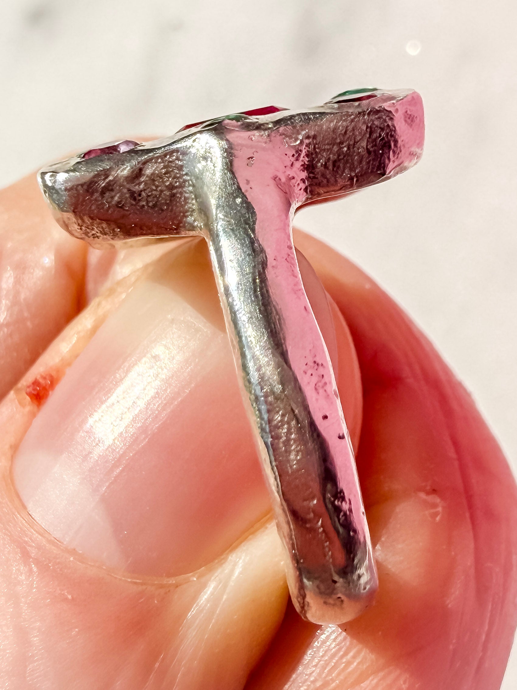 Lab ruby, emerald and pink tourmaline handmade silver oblong ring up close of ring shank texture