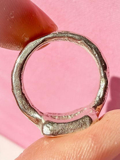 Lab ruby, emerald and pink tourmaline handmade silver oblong ring up close of ring texture 2