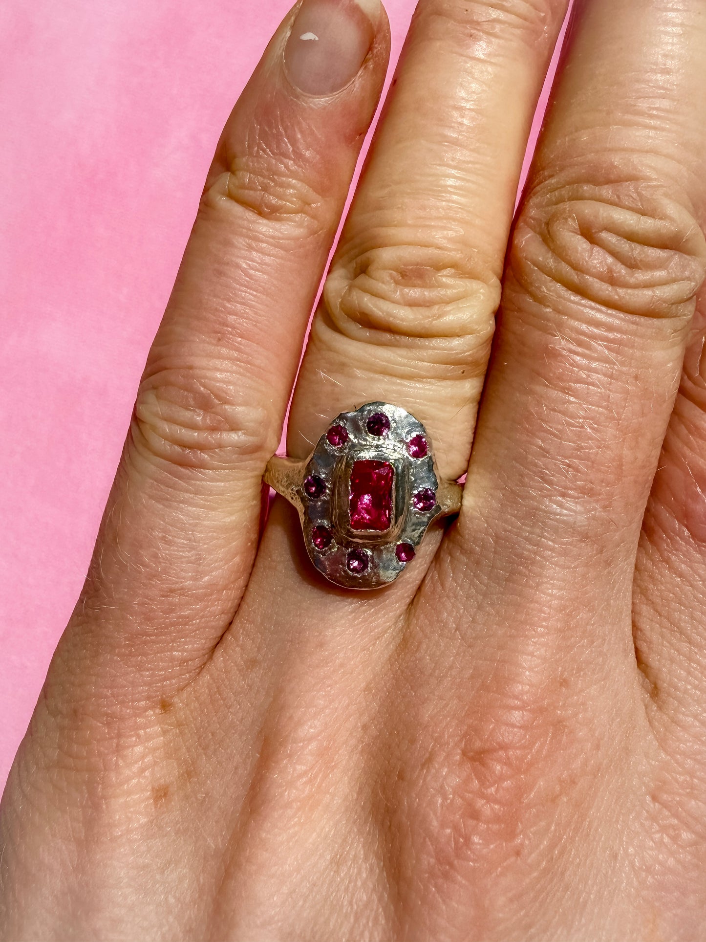 Lab ruby, rhodolite and ruby handmade silver oval ring on hand