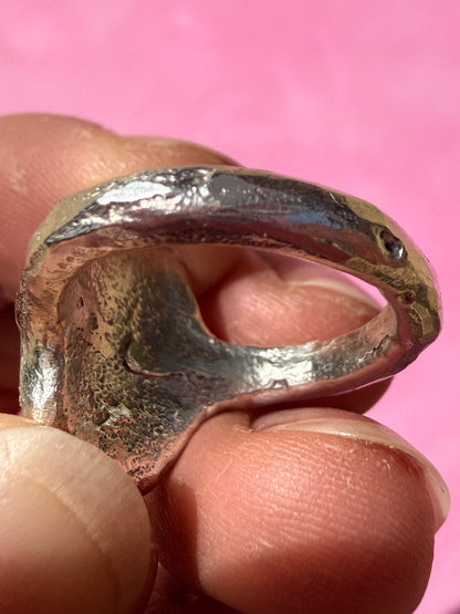 Lab ruby, rhodolite and ruby handmade silver oval ring up close sand cast texture on ring shank 2