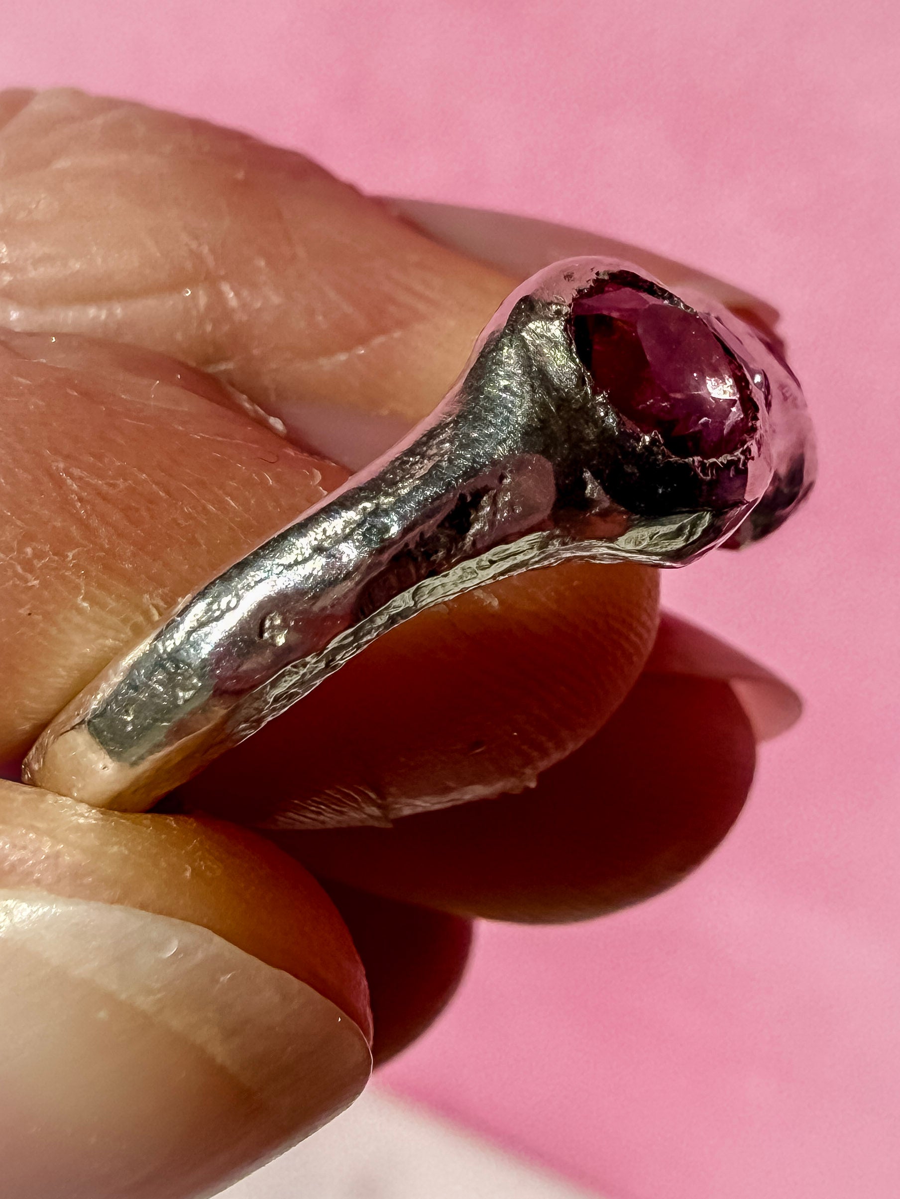 Natural pink tourmaline and lab-grown moissanite handmade silver ring up close ring shank 4