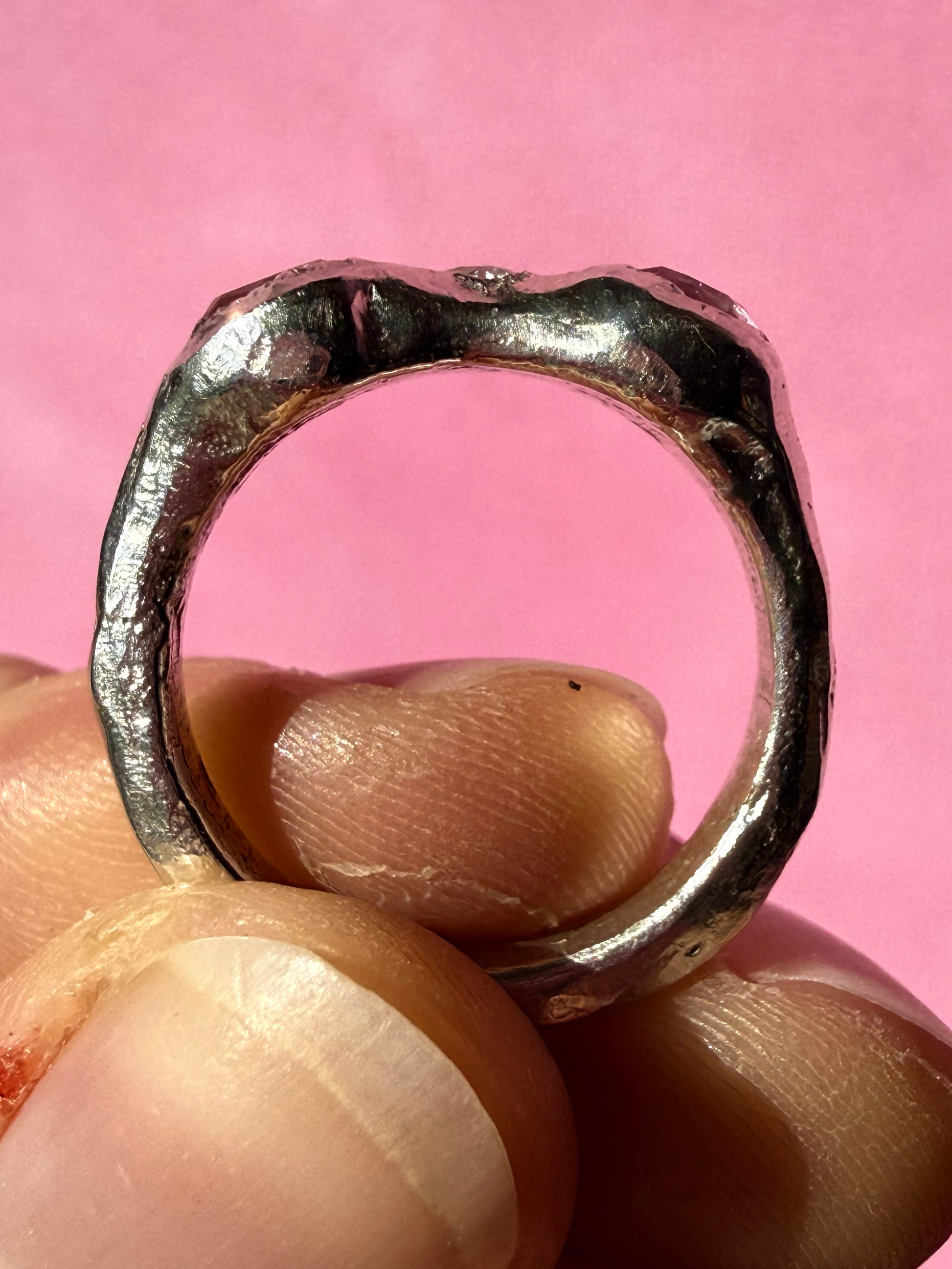 Natural pink tourmaline and lab-grown moissanite handmade silver ring up close ring shank 2