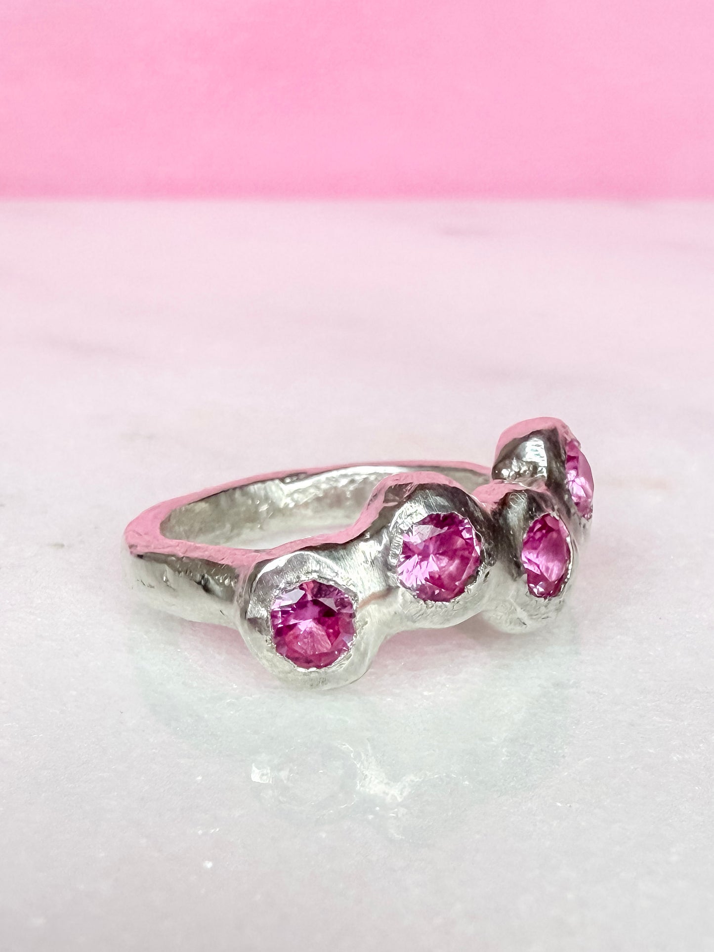 Pink Lab-Grown Sapphire Silver Handmade Ring side view on white background