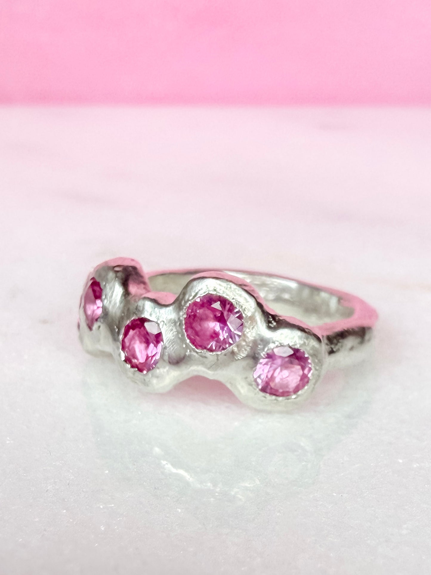 Pink Lab-Grown Sapphire Silver Handmade Ring on white background 2