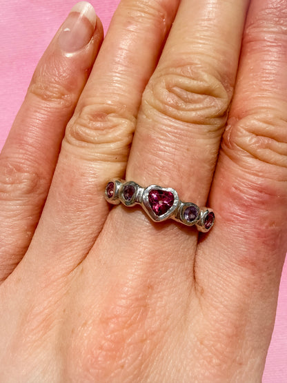 Pink topaz heart, light purple amethyst, and pink topaz handmade silver ring on hand