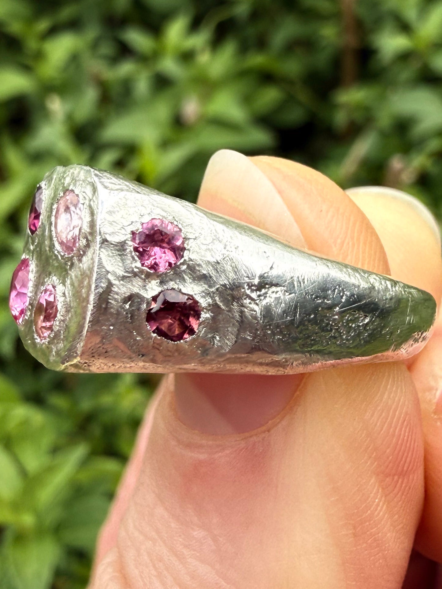Pink tourmaline and pink sapphire handmade silver signet ring sand cast texture up close 1