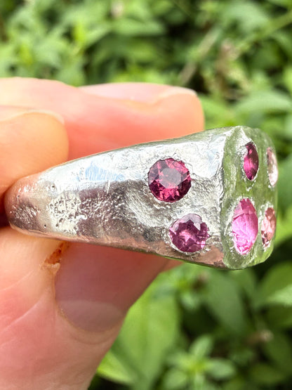 Pink tourmaline and pink sapphire handmade silver signet ring sand cast texture up close side view