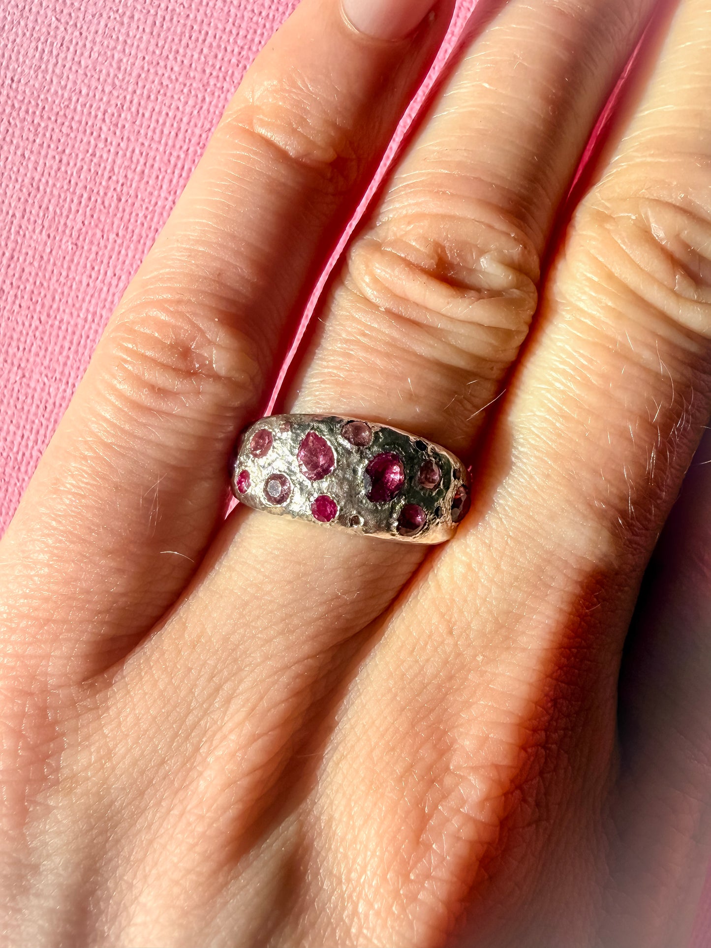 Pink tourmaline, rubelite and ruby handmade silver ring on hand