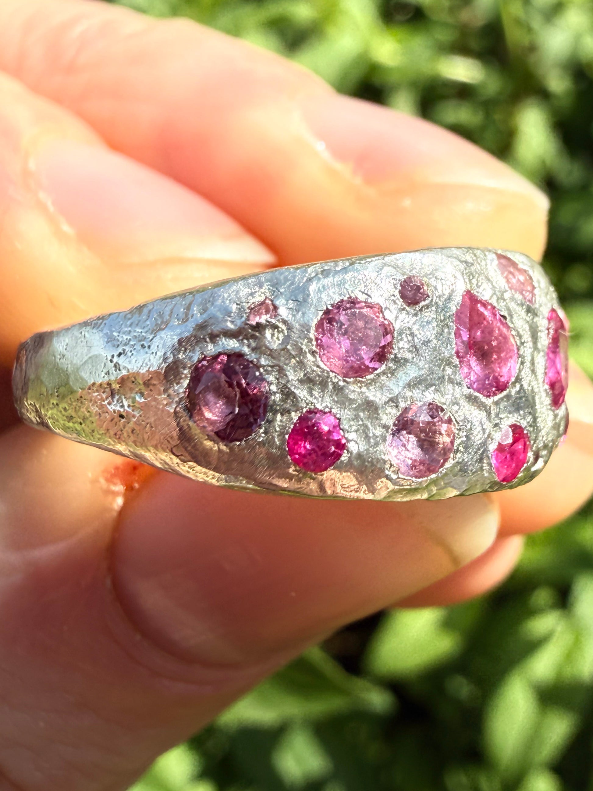 Pink tourmaline, rubelite and ruby handmade silver ring close up of sand cast texture 4