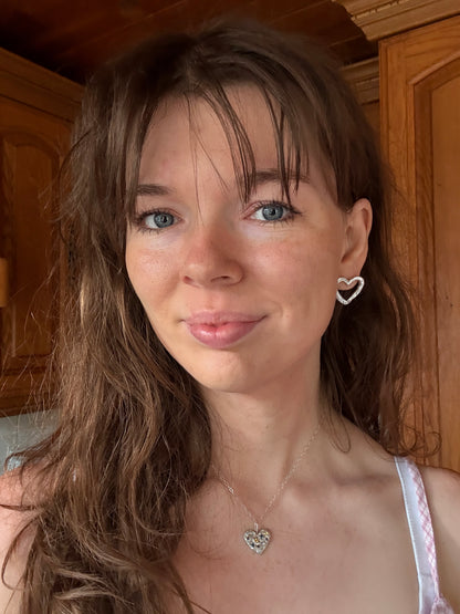 Silver Heart Stud Earrings on Woman 