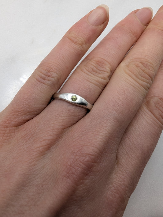 Skinny Minnie Peridot Stacking Ring in Sterling Silver on Hand