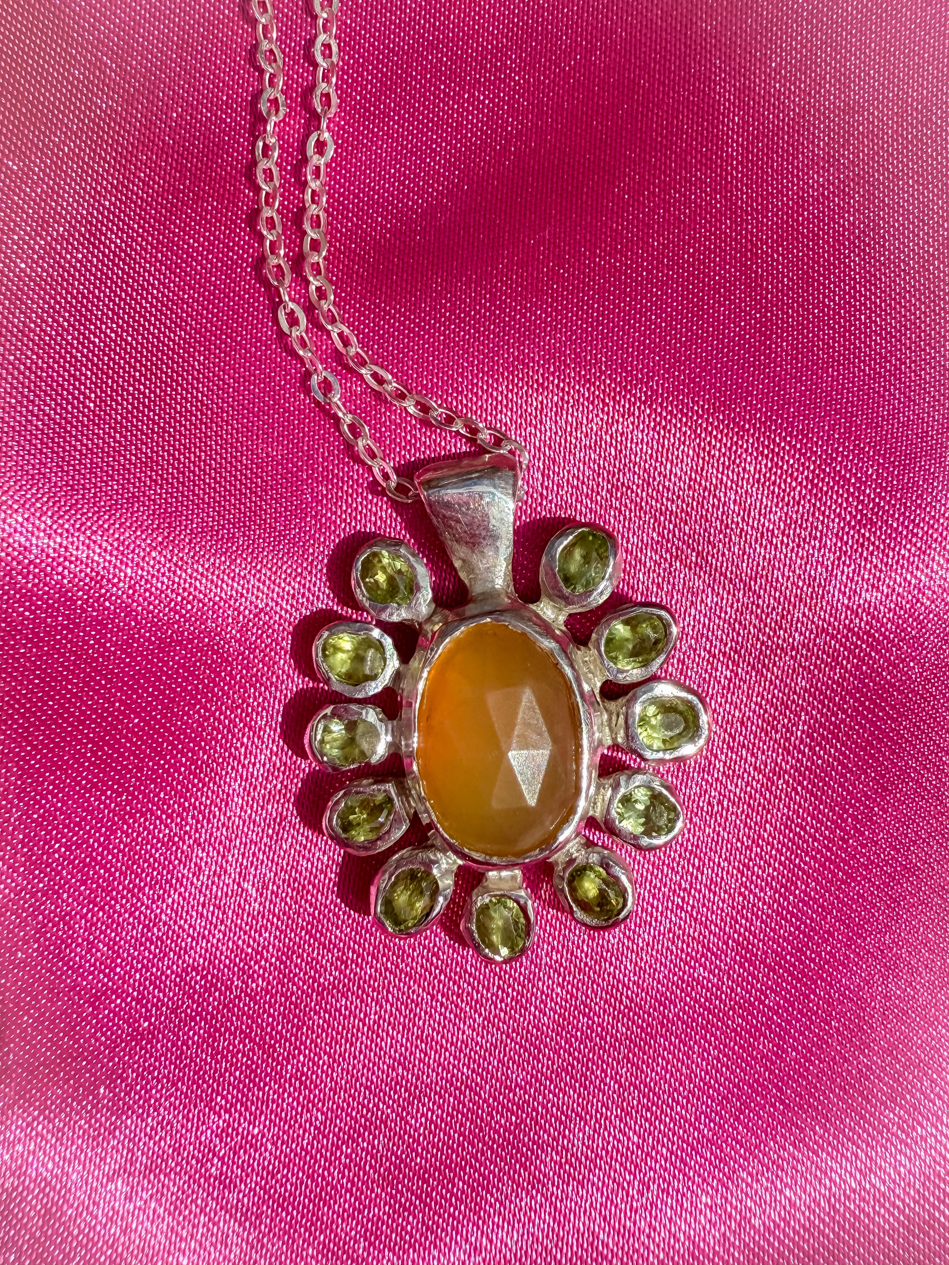 Silver flower shaped pendant with yellow opal and peridot gemstones