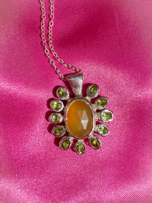 Silver flower shaped pendant with yellow opal and peridot gemstones