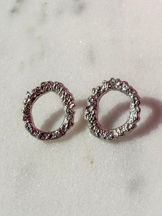 Textured Circular Handmade Silver Earrings  on marble surface