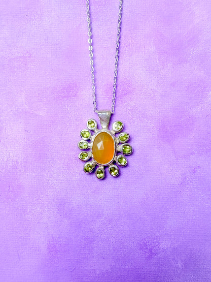 Yellow opal slice, peridot and sterling silver pendant on purple background 2