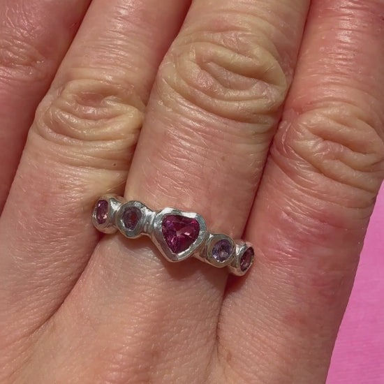 Pink topaz heart, light purple amethyst, and pink topaz handmade silver ring video of ring on hand in the sun