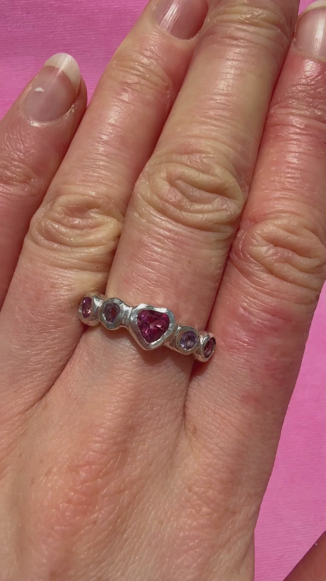 Pink topaz heart, light purple amethyst, and pink topaz handmade silver ring video of ring on hand in the sun
