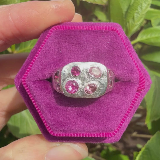Pink tourmaline and pink sapphire handmade silver signet ring sparkling in sun