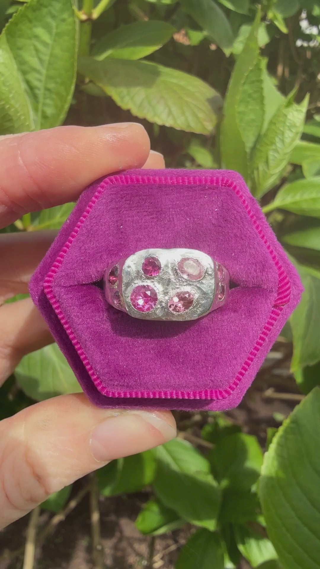 Pink tourmaline and pink sapphire handmade silver signet ring sparkling in sun