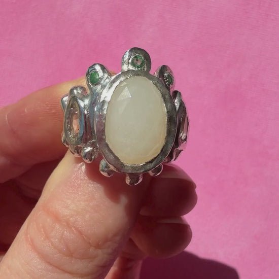 White moonstone slice, peach morganite faceted pear and emerald handmade silver ring video of ring shining in the sun