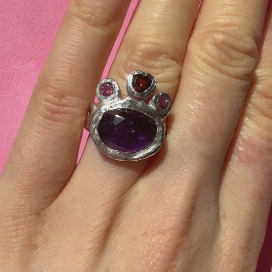 Dark amethyst slice, garnet heart, pink topaz and ruby handmade silver ring video of ring on hand in the sun