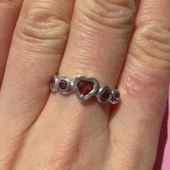 Garnet heart, rhodolite garnet, and pink tourmaline handmade silver ring video of ring on hand sparkling in the sun