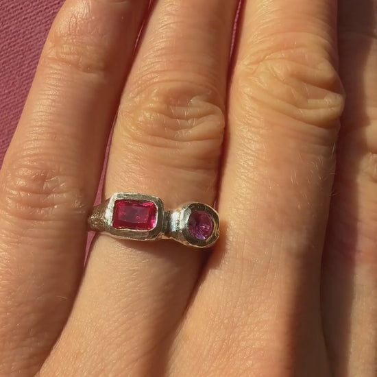 Lab grown octagon ruby and lab grown round pink sapphire handmade silver ring sparkling in the sun on hand